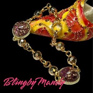 Pretty chain link bracelet, gold tones with purple and gold flecked charm links